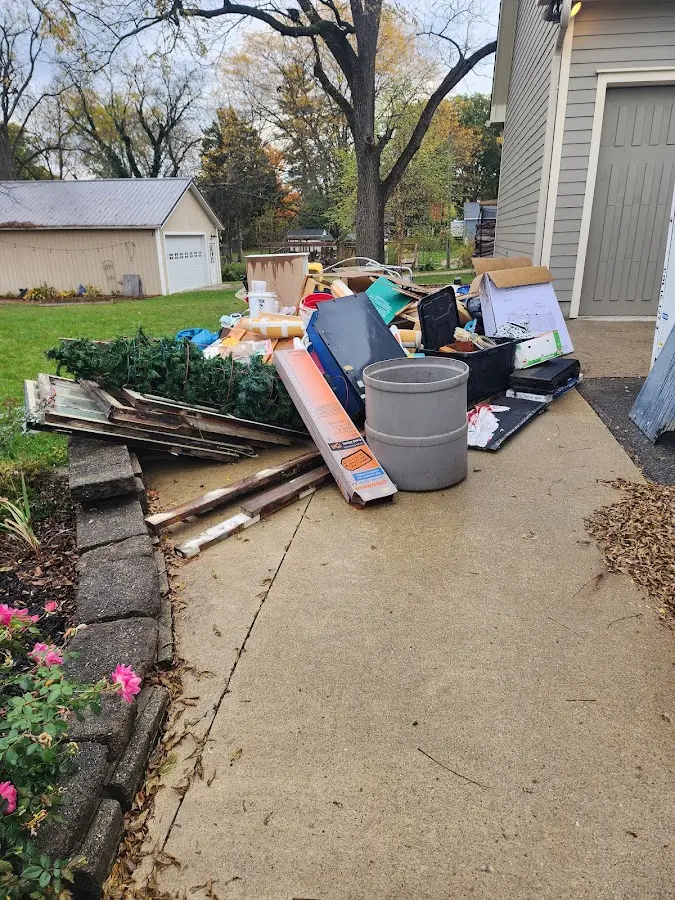 Dumpster being loaded with debris for Residential Dumpster Rental in Sabattus